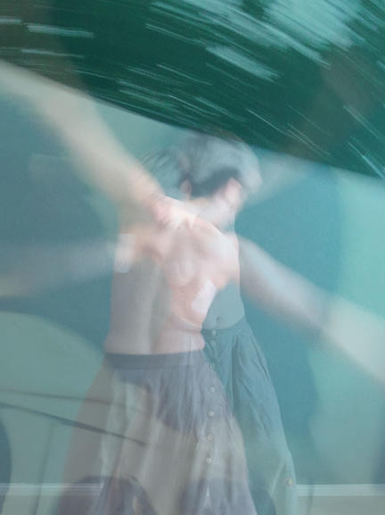 blurred picture of a naked back of a dancing person